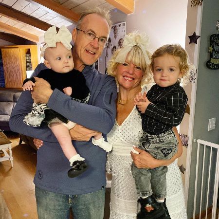 Stormie Lynch and her husband Mark Lynch took a picture with their grandkids.